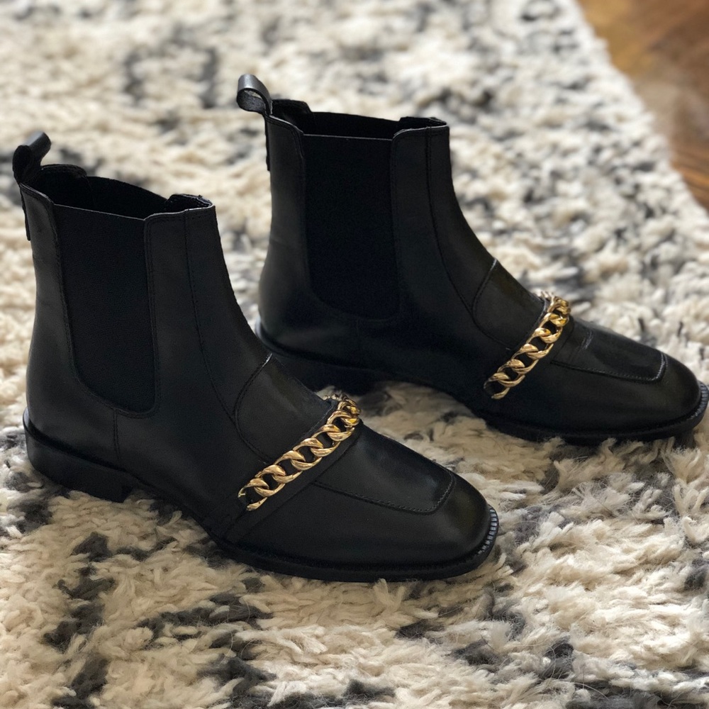 Black ASOS DESIGN boot with gold chain detail.
